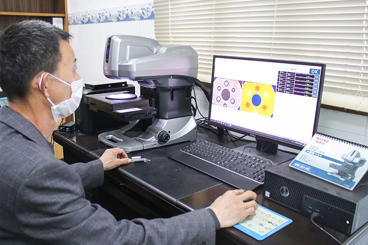 Zhenhua engineer reviewing customer drawing